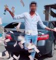 شرطة دبي تطيح بشاب ظهر في فيديو وهو يرمي الأموال في الشارع بقصد التباهي